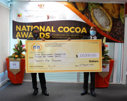 Mr. Kelvin Mahabir CEO (left) of NFM presents a cheque of $25,000.00 to the Chairman of the National Organising Committee, Mr. Leon Granger, (CDCTTL CEO)